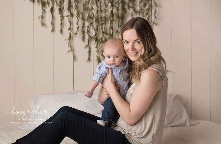 Mom holding baby boy in studio baby milestone photography session Baby Photography Calgary AB